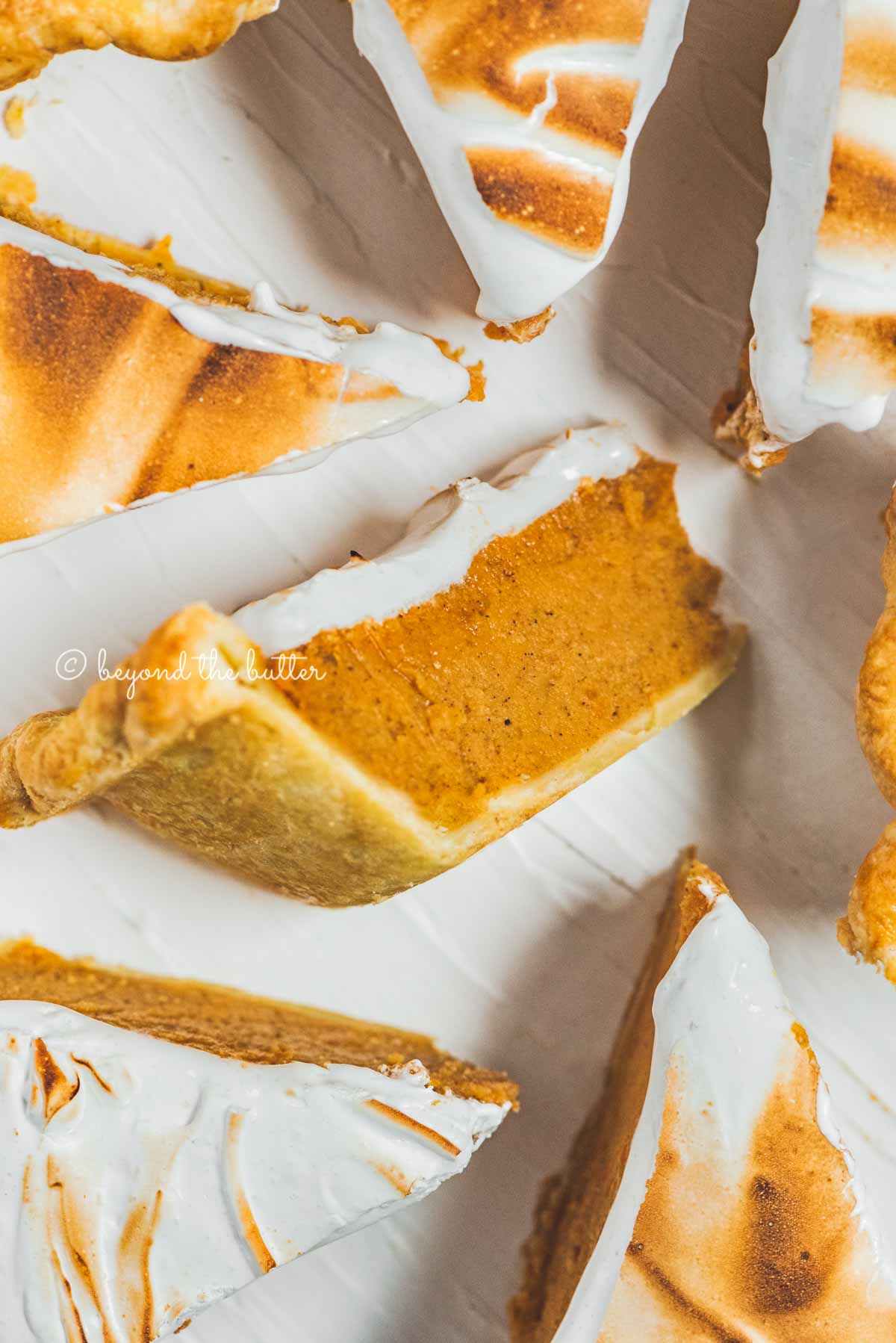 Slices of brown sugar sweet potato pie with center slice on its side | All Images © Luyiz®