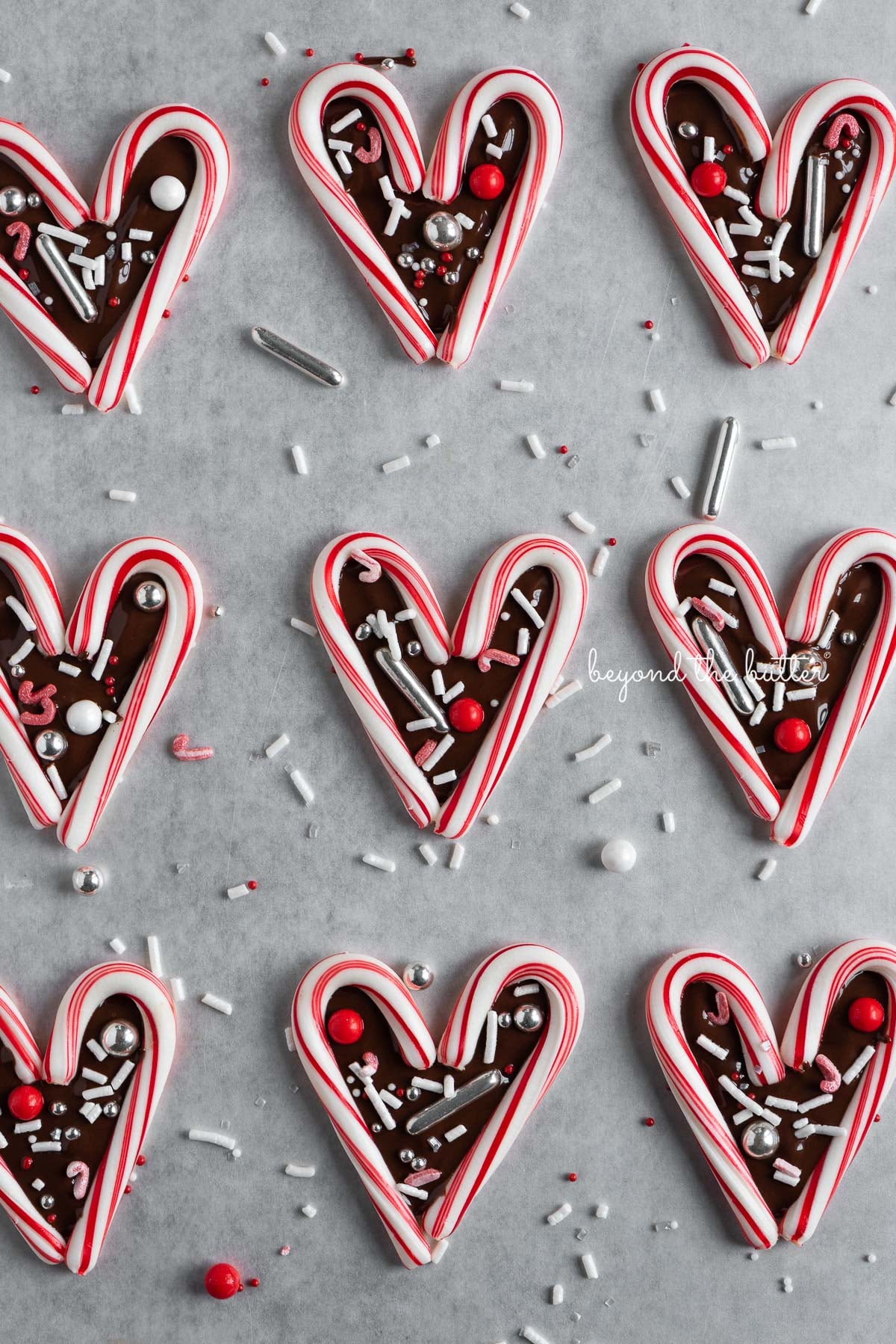 Fun candy cane hearts on parchment paper | © Luyiz®