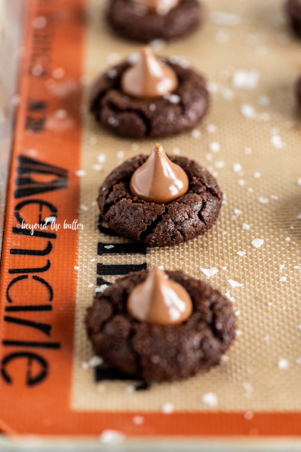 Angled image of Chocolate Caramel Blossoms on cookie sheet | All Images © Luyiz, LLC