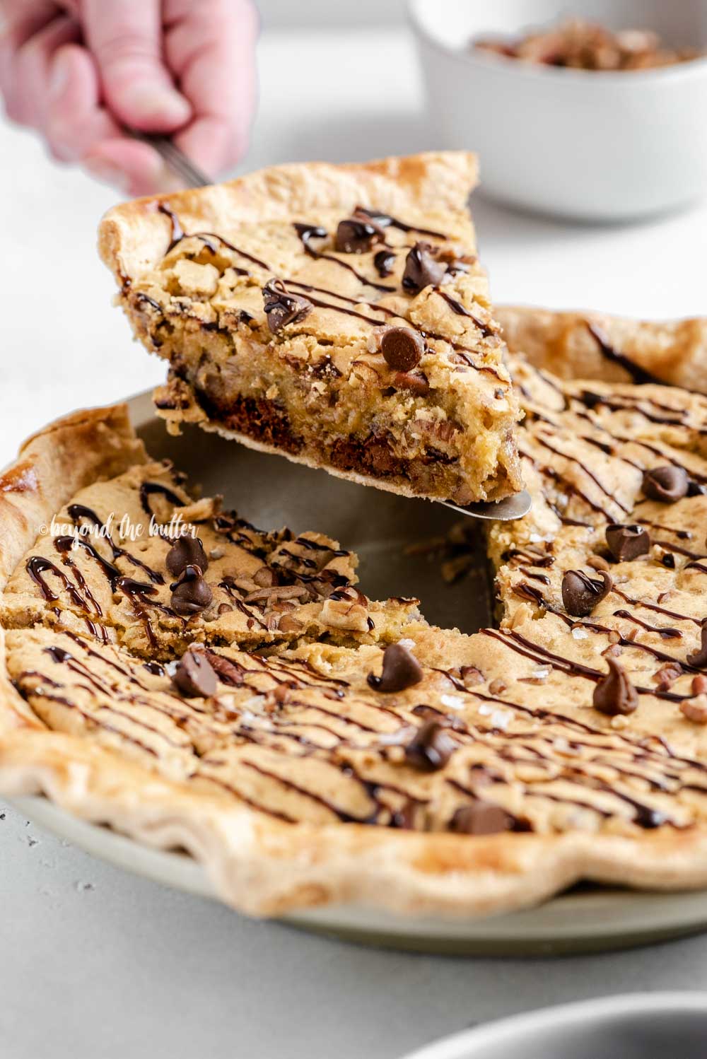 Closeup image of slice of chocolate chip pie being served | All Images © Luyiz™