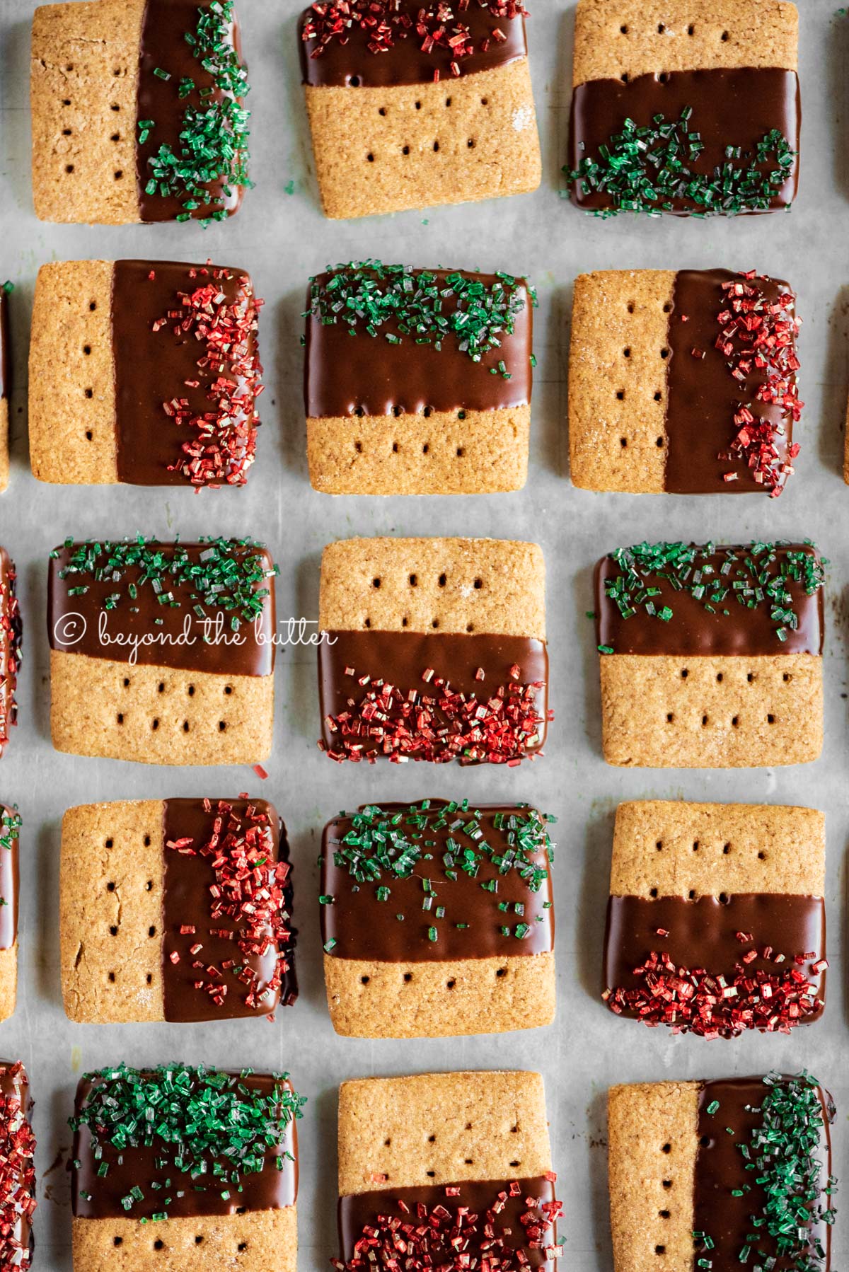 Cookie sheet with rows of Chocolate Dipped Graham Cracker Sqaures | © Luyiz®