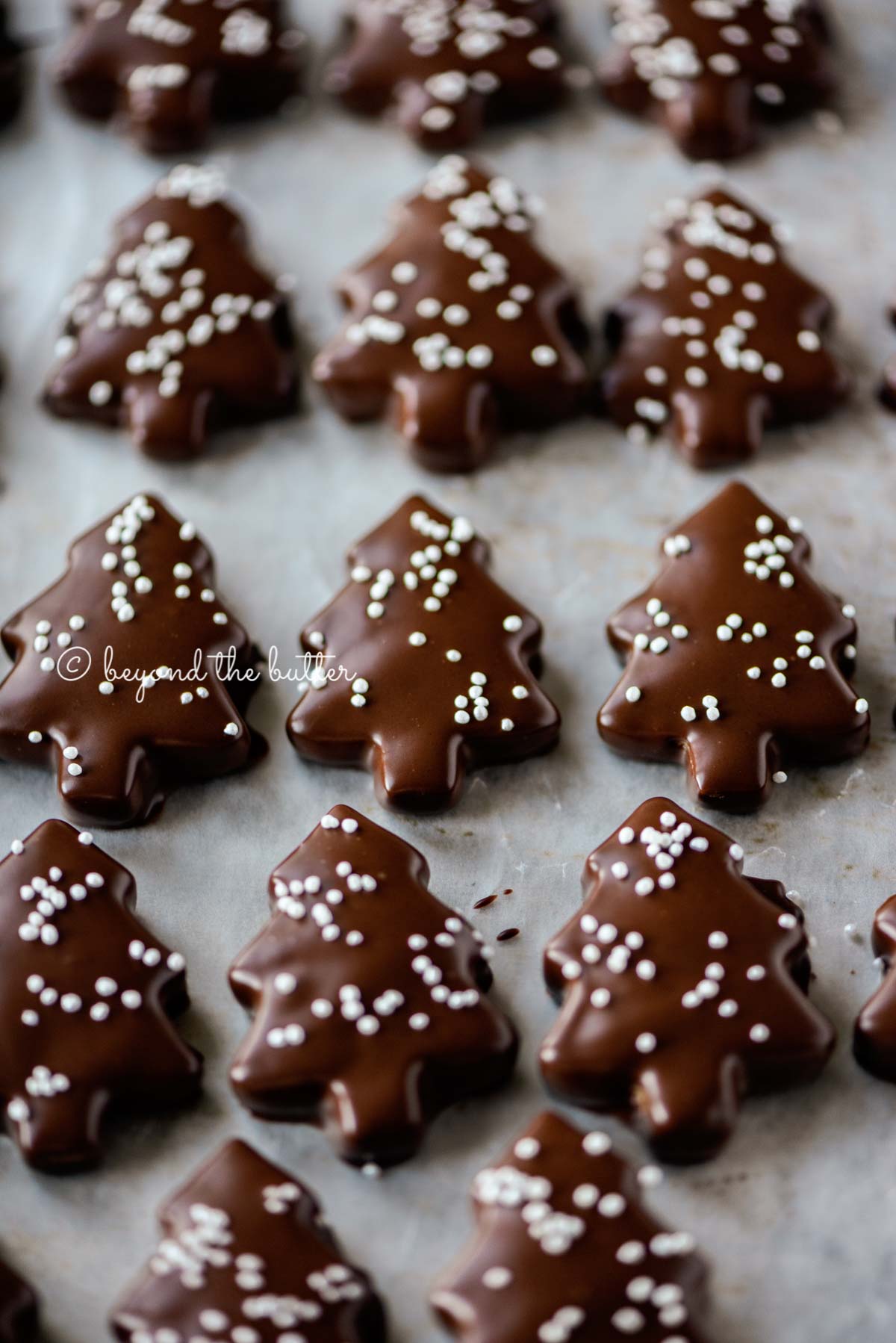 Chocolate Dipped Graham Cracker Chrismtas Trees on a cookie sheet | © Luyiz®