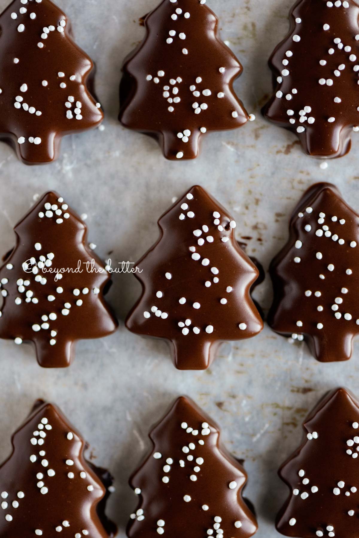 Chocolate Dipped Graham Cracker Chrismtas Trees on a cookie sheet | © Luyiz®