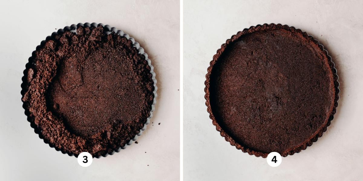 Chocolate cookie crust being pressed into a tart pan placed on a white background.
