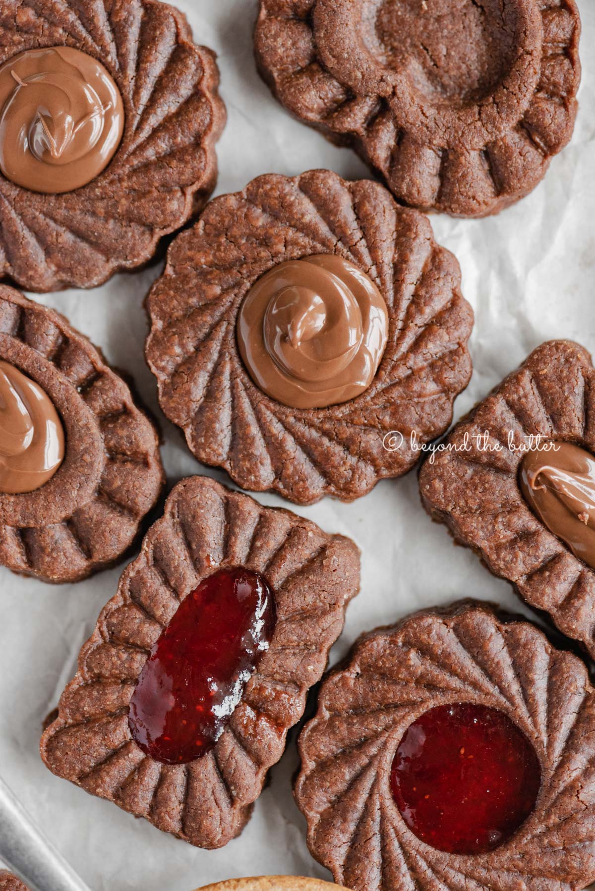 Closeup image of chocolate thumbprint cookies | All Images © Luyiz®
