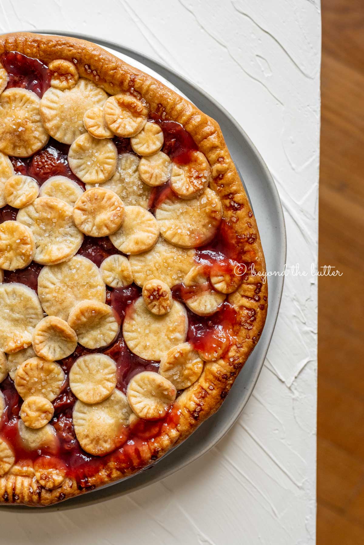 Image of cherry pie placed close to the edge of the table | All Images © Luyiz™