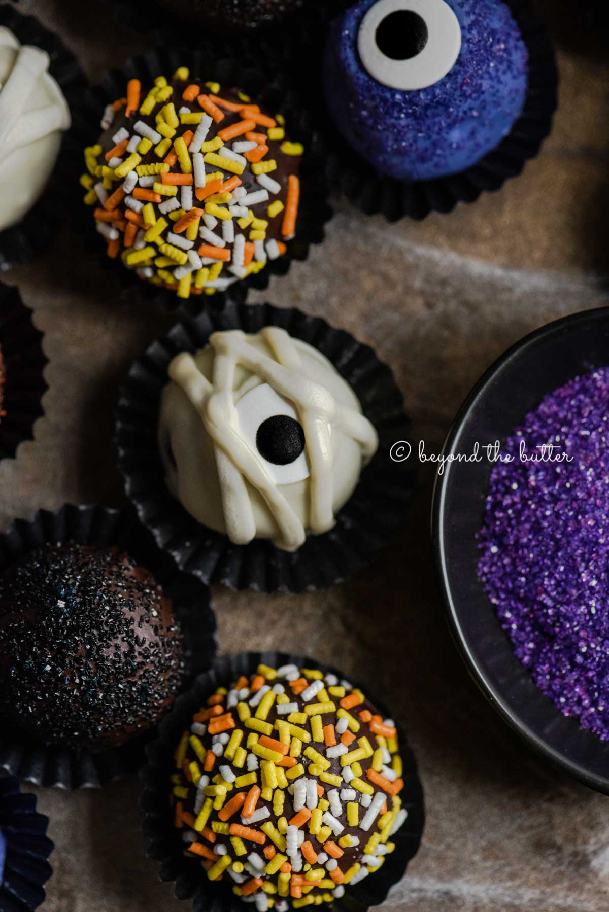 Closeup of Halloween Chocolate Truffles on dark brown background | All Images © Luyiz™