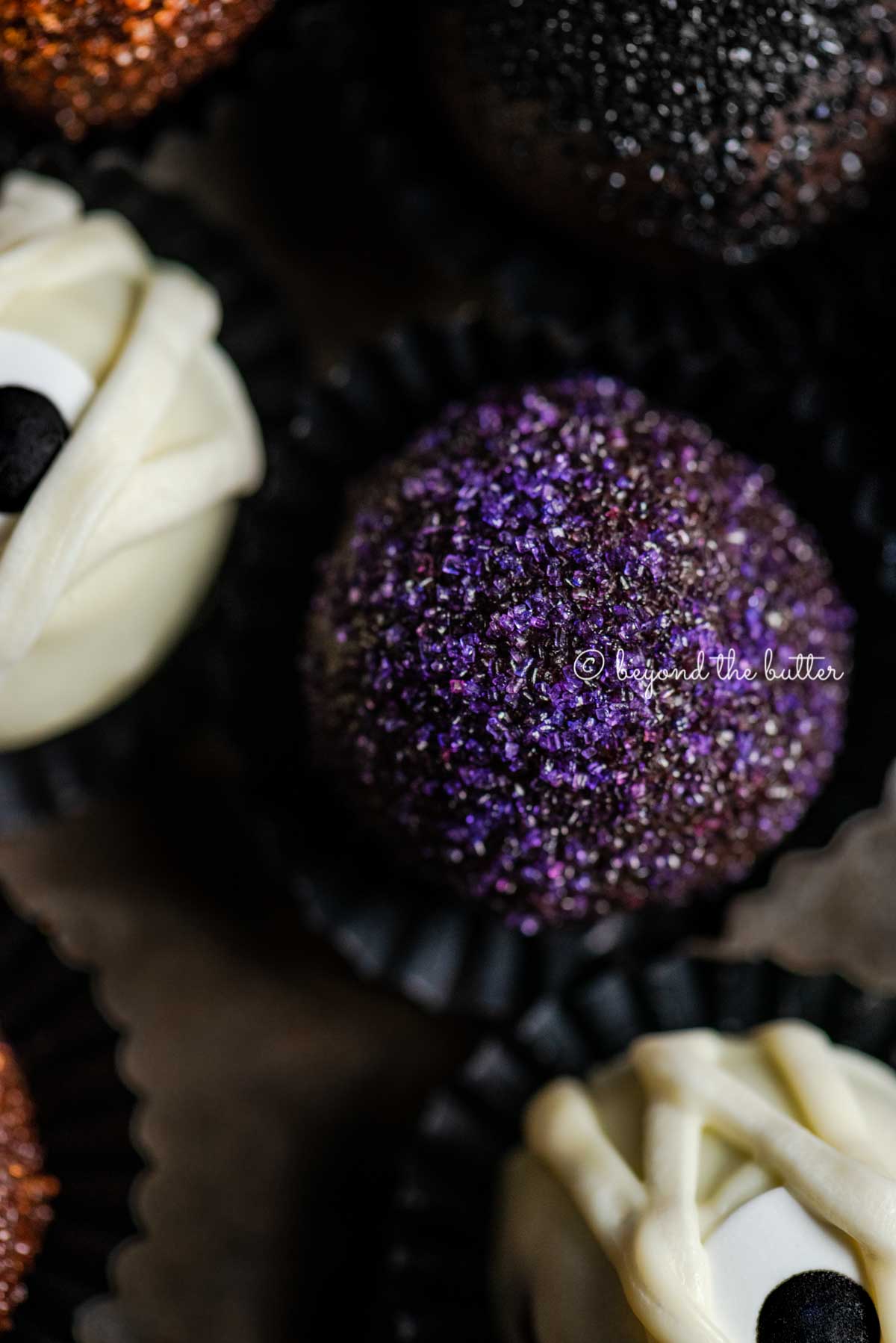 Closeup of Halloween Chocolate Truffles on dark brown background | All Images © Luyiz™