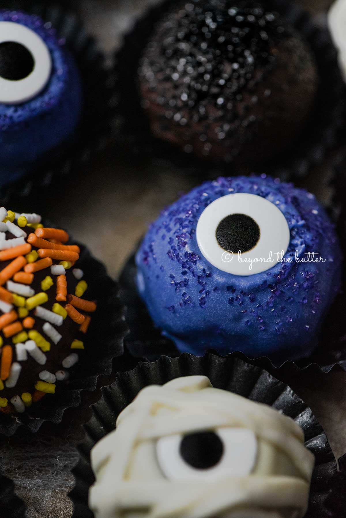 Closeup of Halloween Chocolate Truffles on dark brown background | All Images © Luyiz™