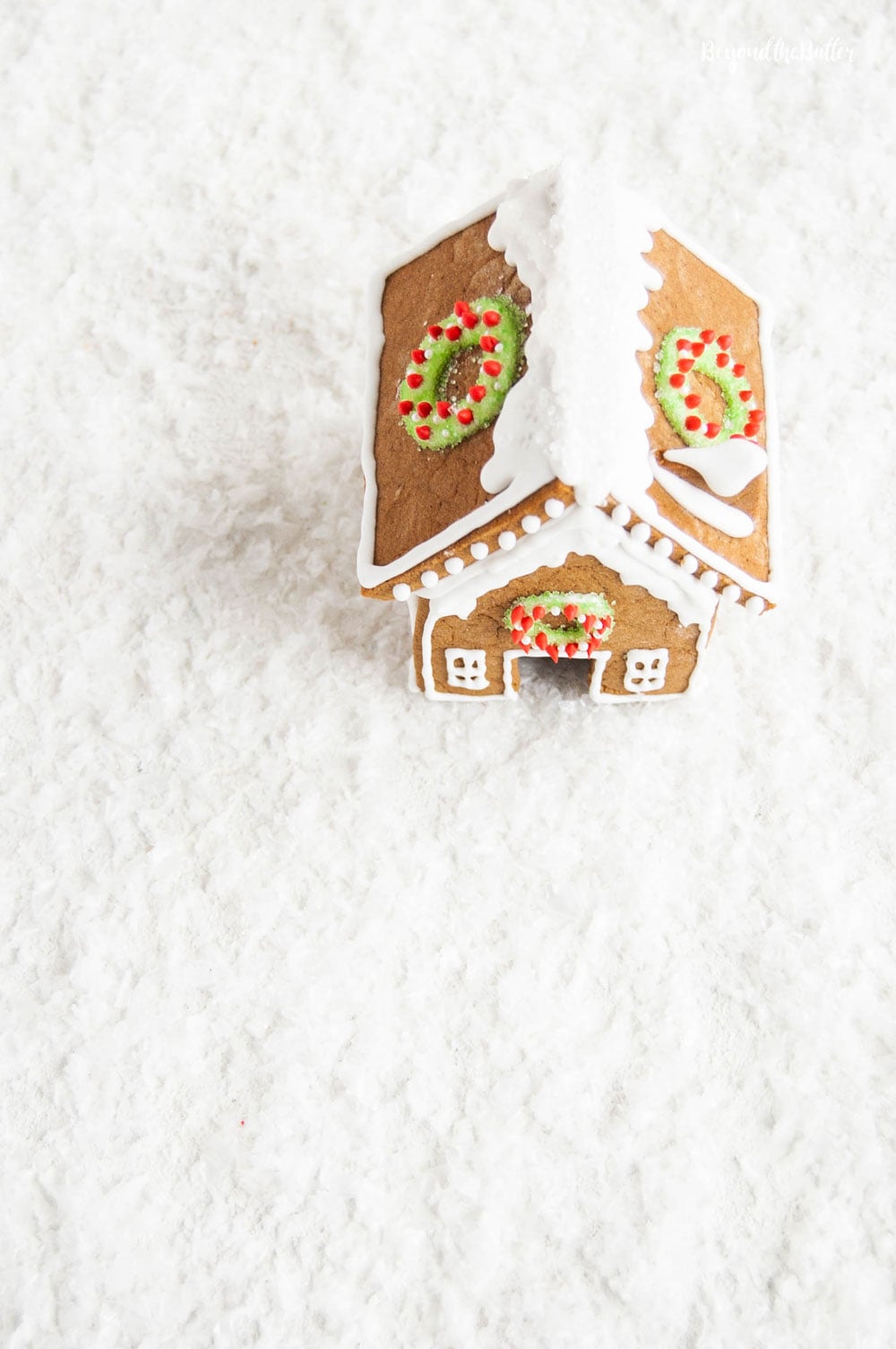 Homemade Gingerbread Houses - Overlooking the roof of one gingerbread house with wreaths on each side | All Images © Luyiz, LLC