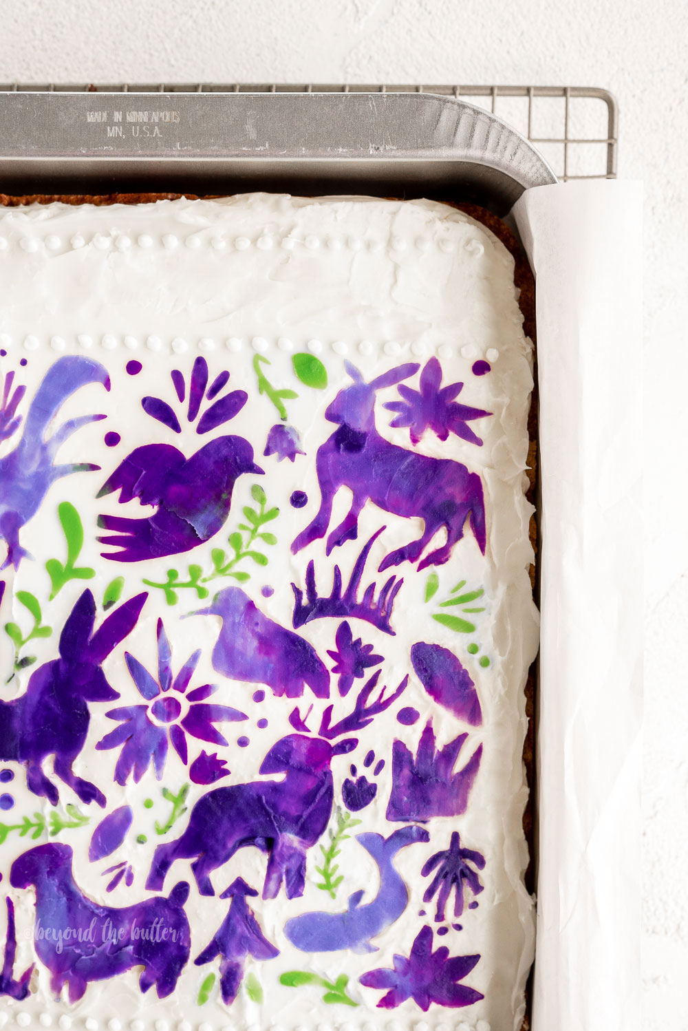 This Hummingbird Sheet Cake is so moist and delicious, and filled with flavors of cinnamon, nutmeg, banana, and pineapple. Top it with this silky White Chocolate Cream Cheese Frosting and you have yourself the perfect dessert! (stencil from Martha Stewart line at Michaels) #hummingbirdsheetcake #sheetcake #Luyiz #creamcheesefrosting #marthastewart