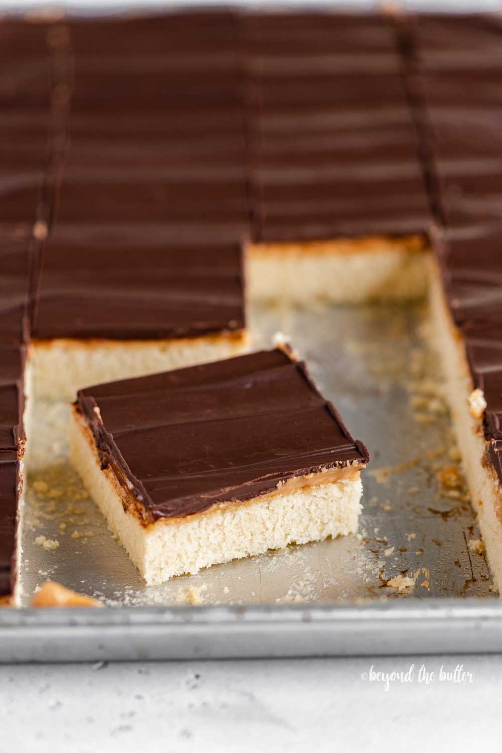 Angled image of cut irresistible peanut butter tandy kakes with one angled out from the rest | All Images © Luyiz™