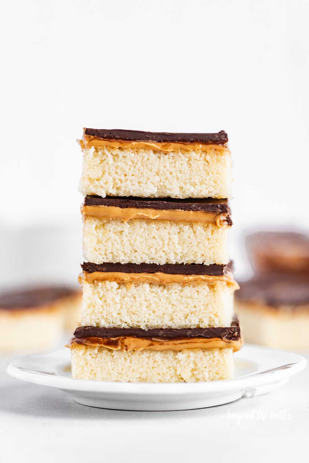Image of stacked homemade peanut butter kandy kakes on a white dessert plate | All Images © Luyiz™