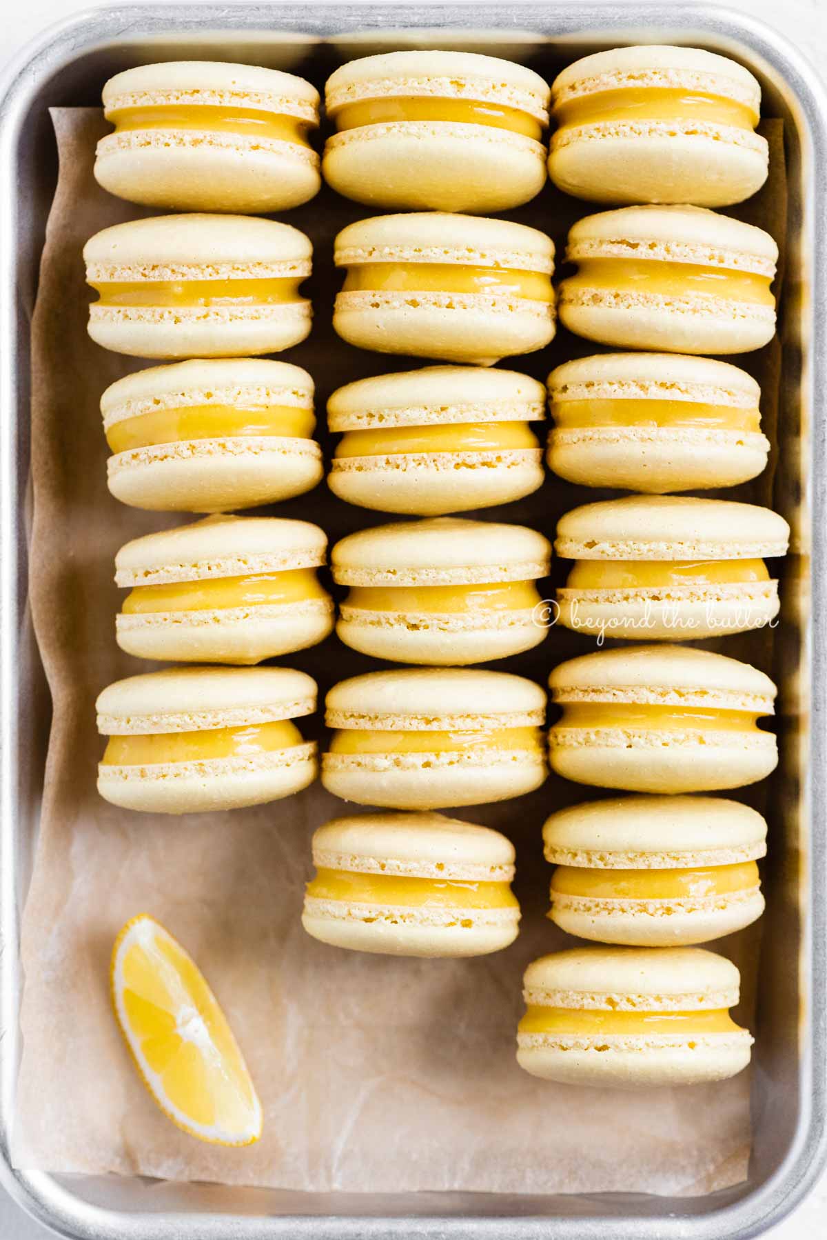 Close up of lemon bar macarons on side on a baking tray | All Images © Luyiz™