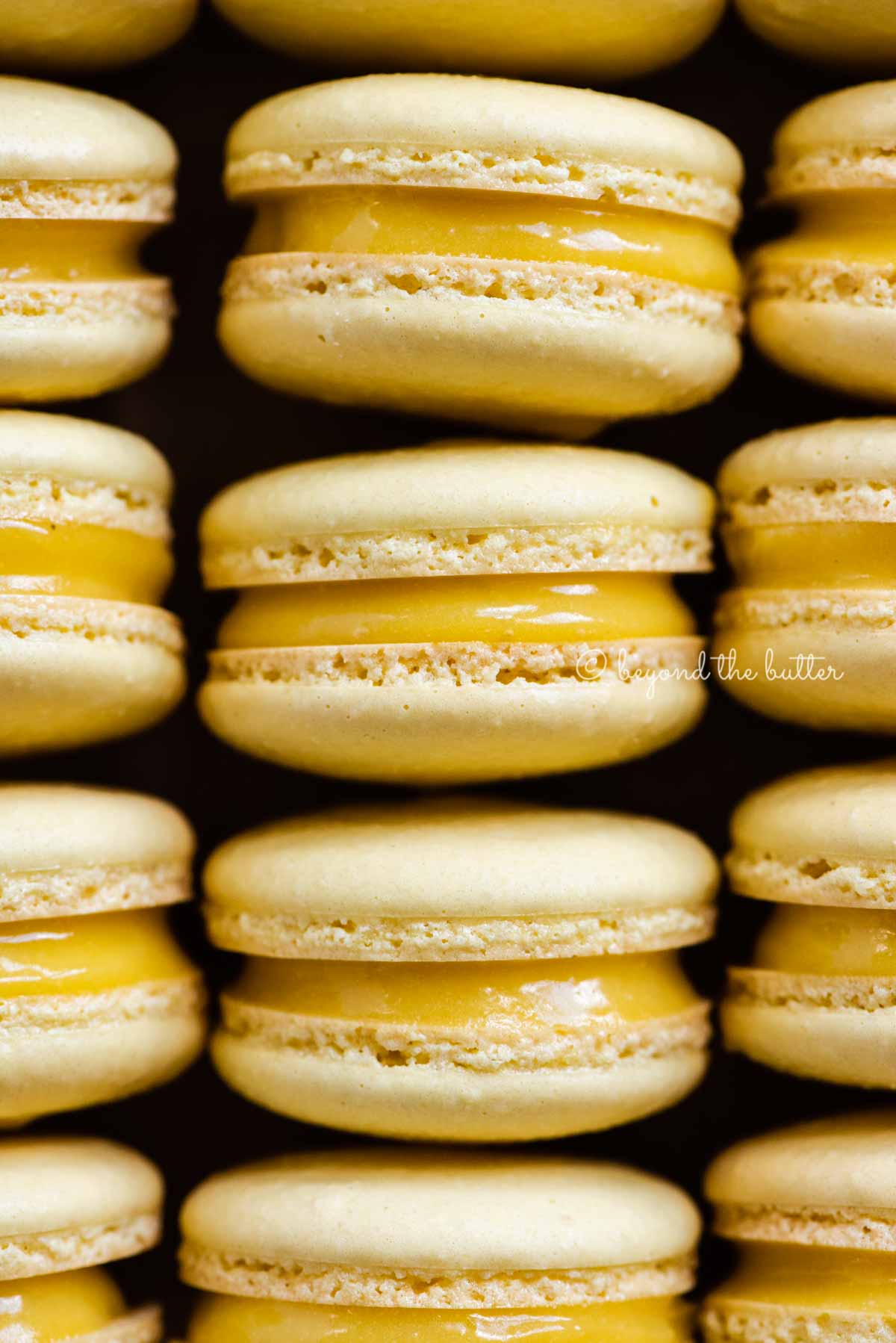 Close up of lemon bar macarons on side | All Images © Luyiz™