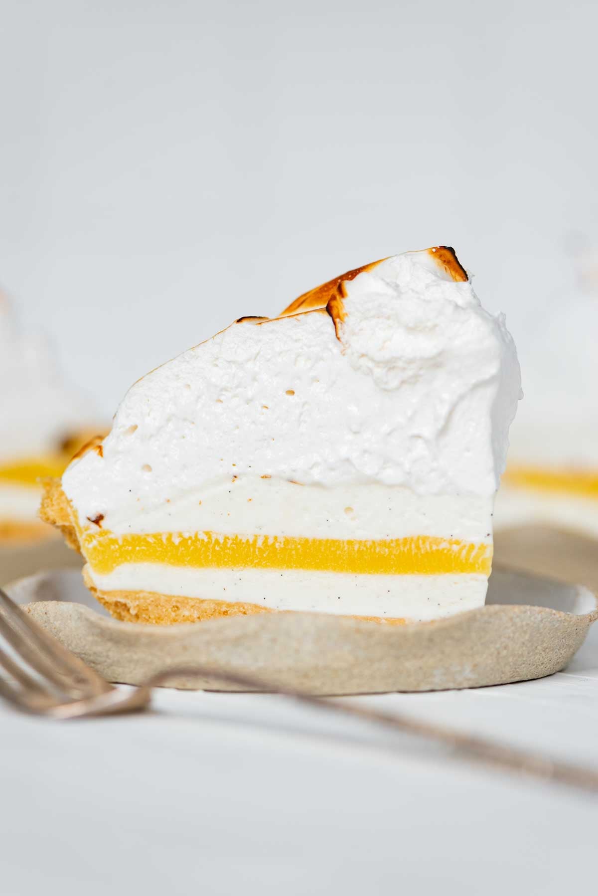 Slices of lemon meringue ice cream pie on dessert plates from Luyiz | © Luyiz®