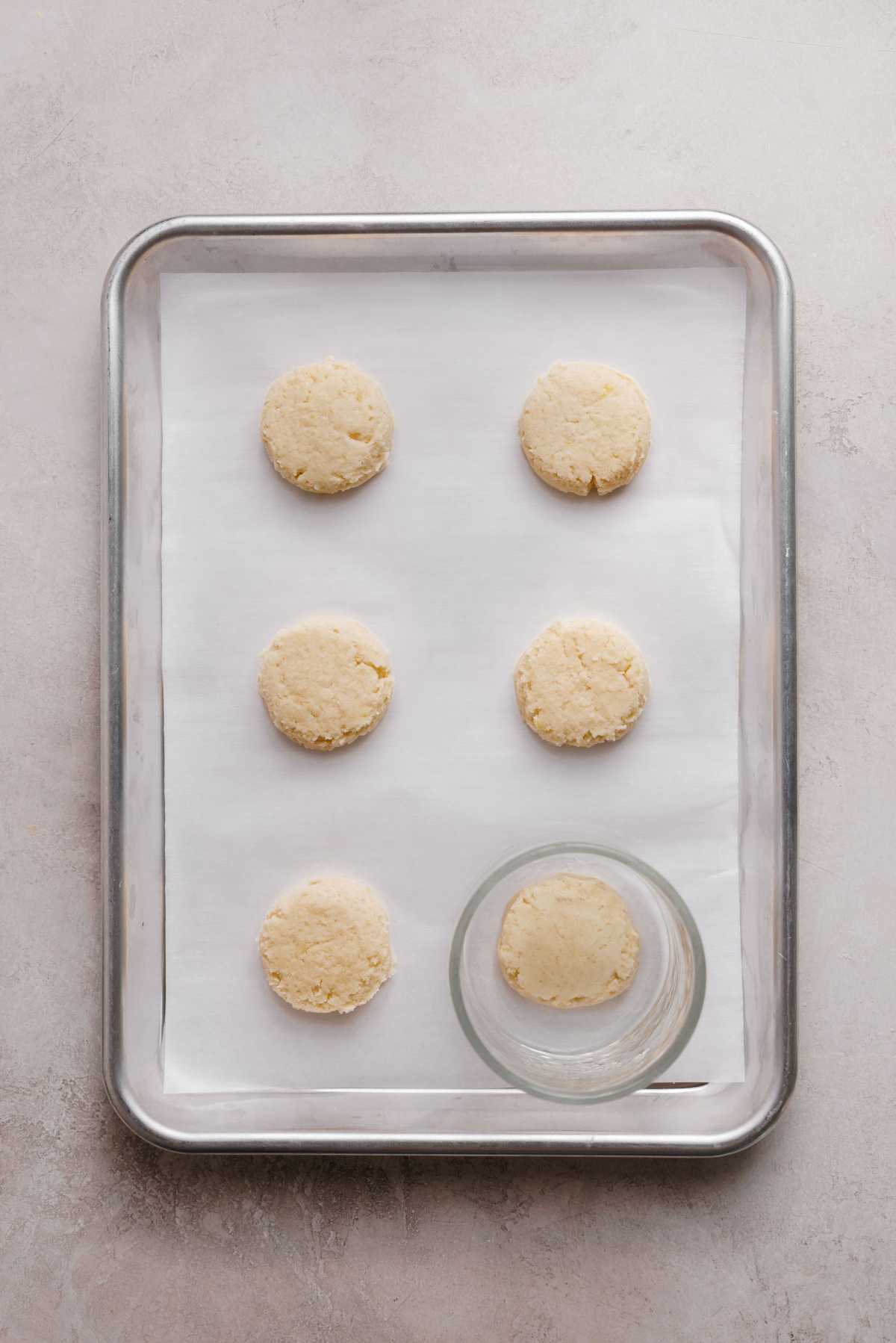 Lemon shortbread cookie dough with flattened tops using the bottom of a glass bowl.