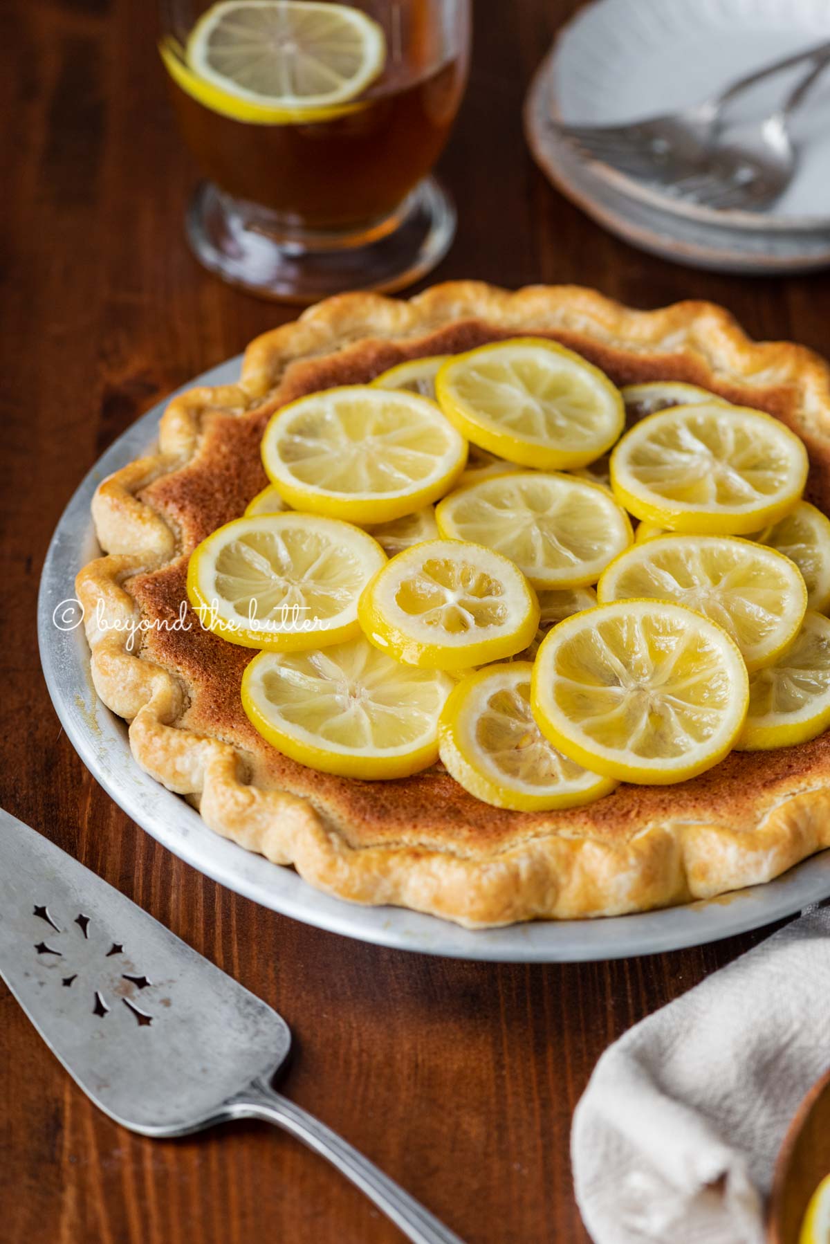 lemon sponge pie on a dark wood dining room table with hot lemon tea | All images © Luyiz®
