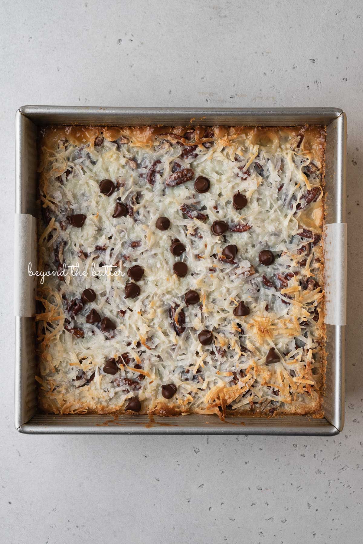 Just baked 7 layer magic cookie bars in 8 inch baking pan | © Luyiz®