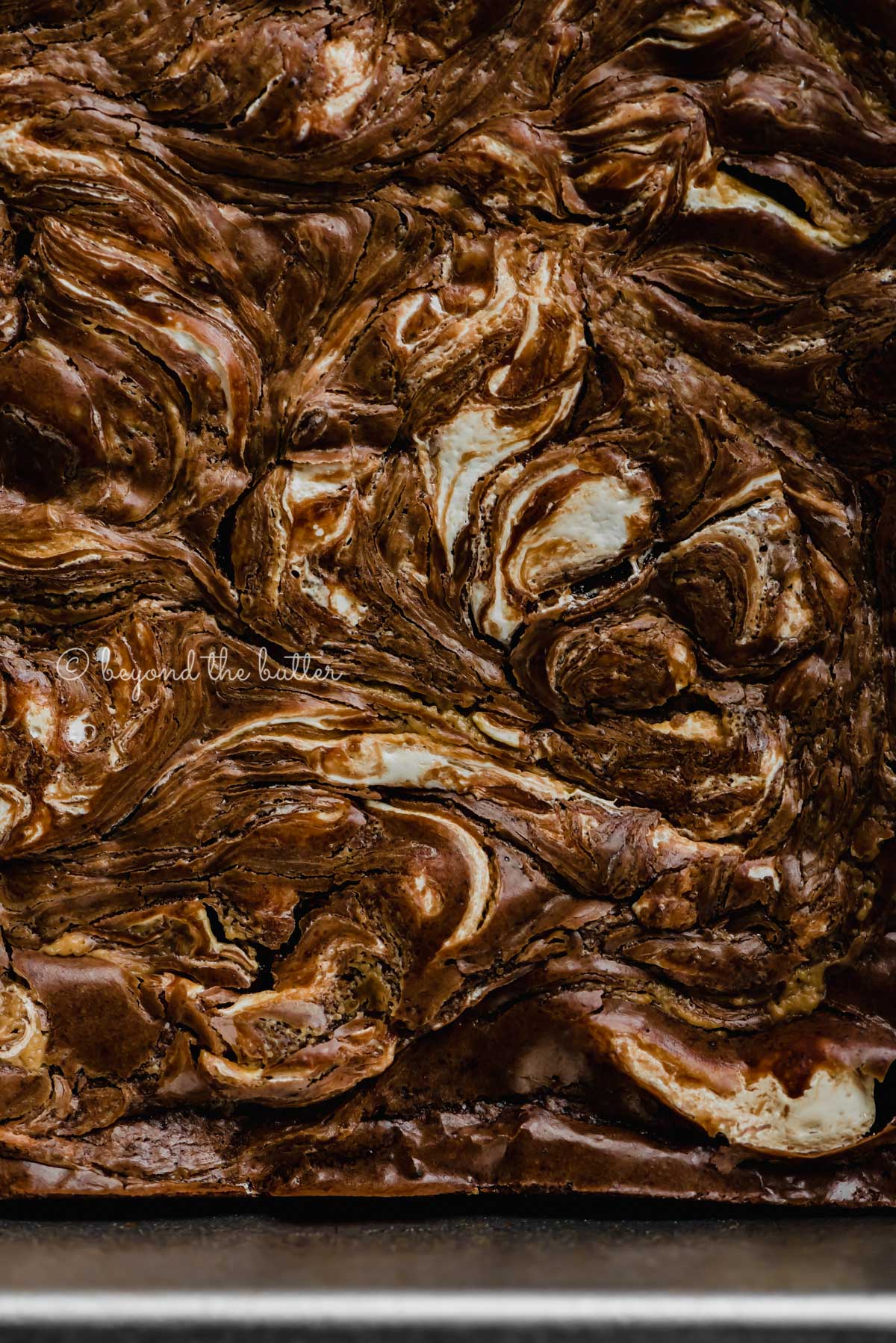 Closeup of baking tray with uncut marshmallow peanut butter brownies | All Images © Luyiz™