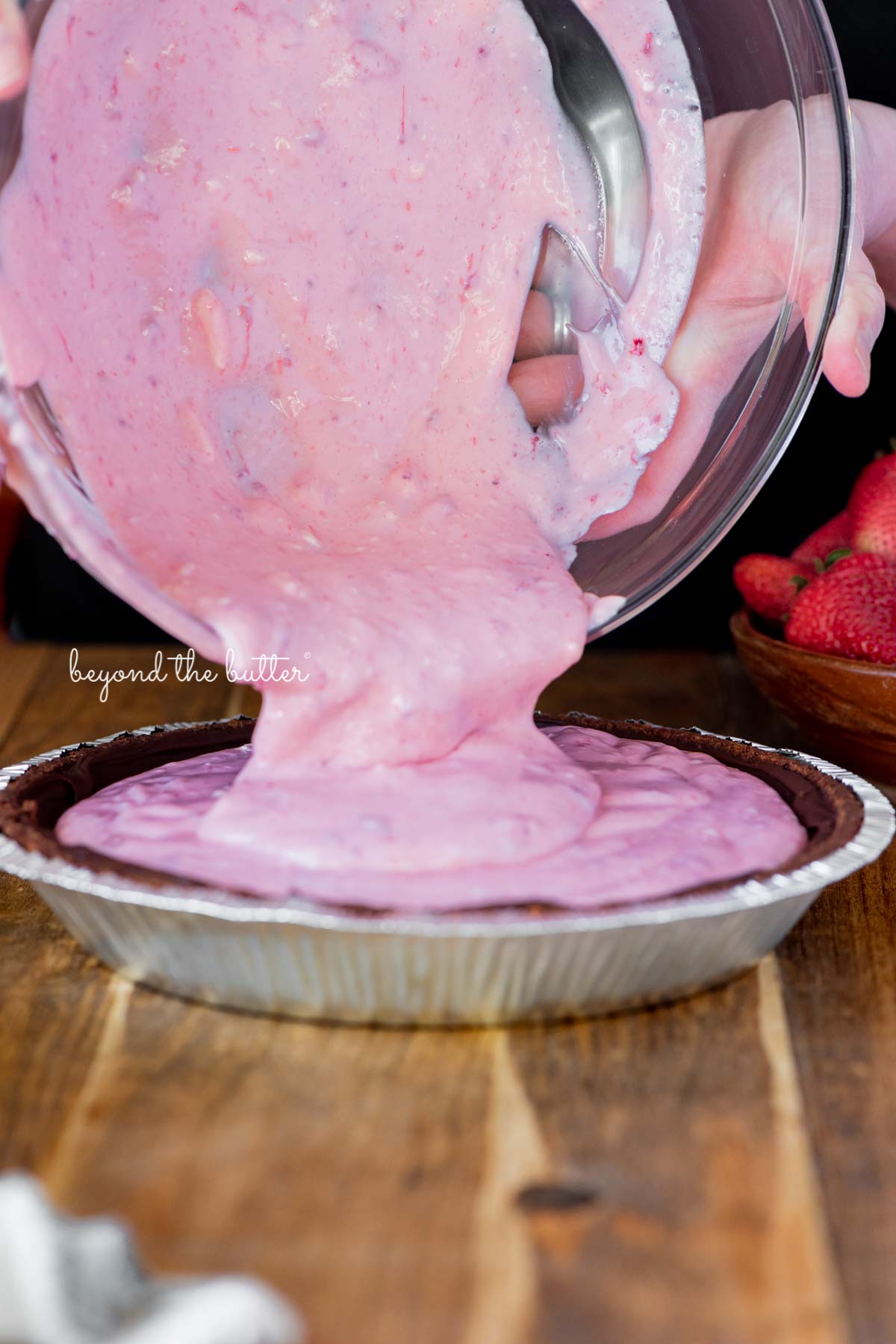 Pouring the strawberry pie filling mixture into the prepared Diamond of CA® chocolate nut pie crust | All images © Luyiz®