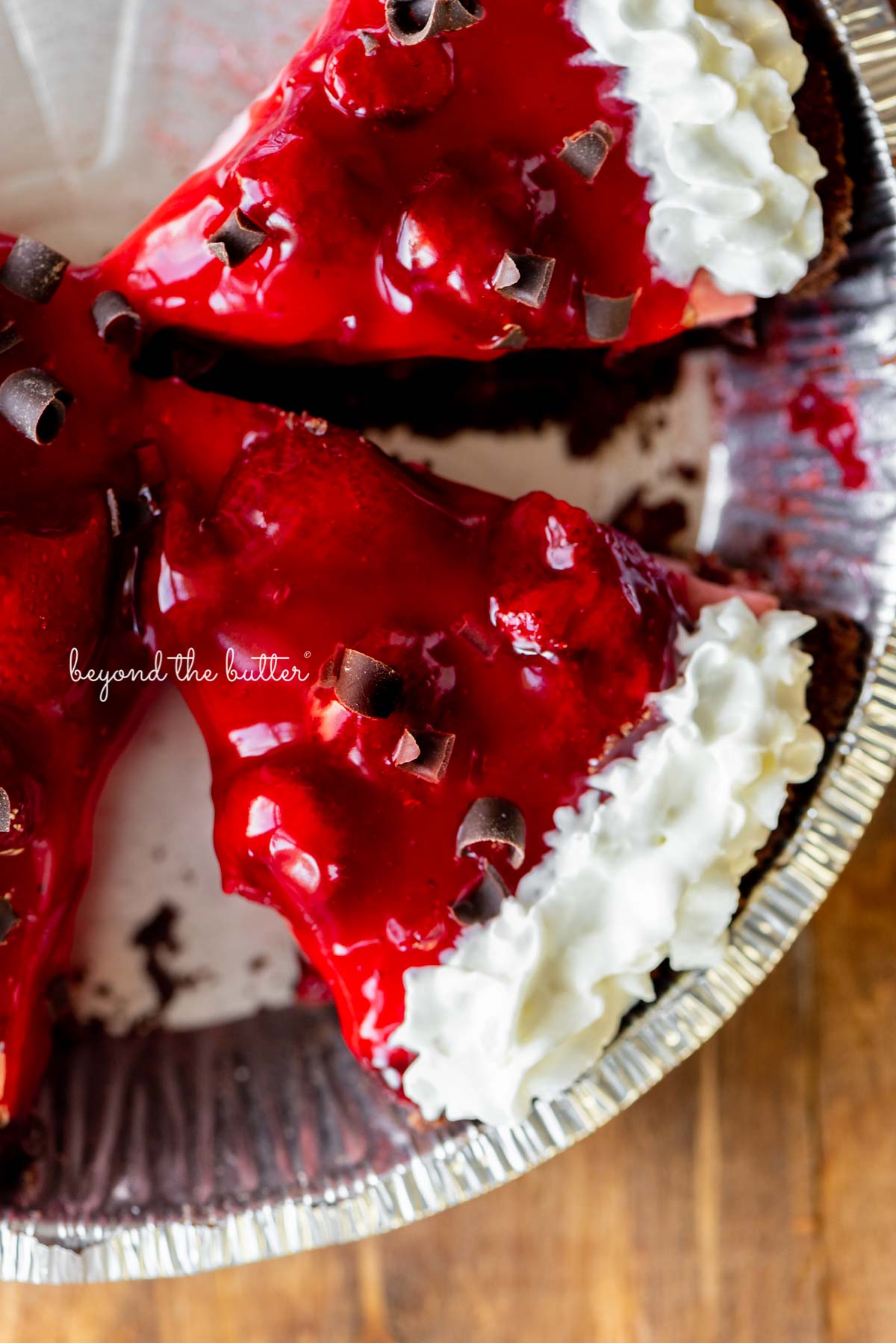 Sliced no bake strawberry chocolate cream pie on wood table | All images © Luyiz®