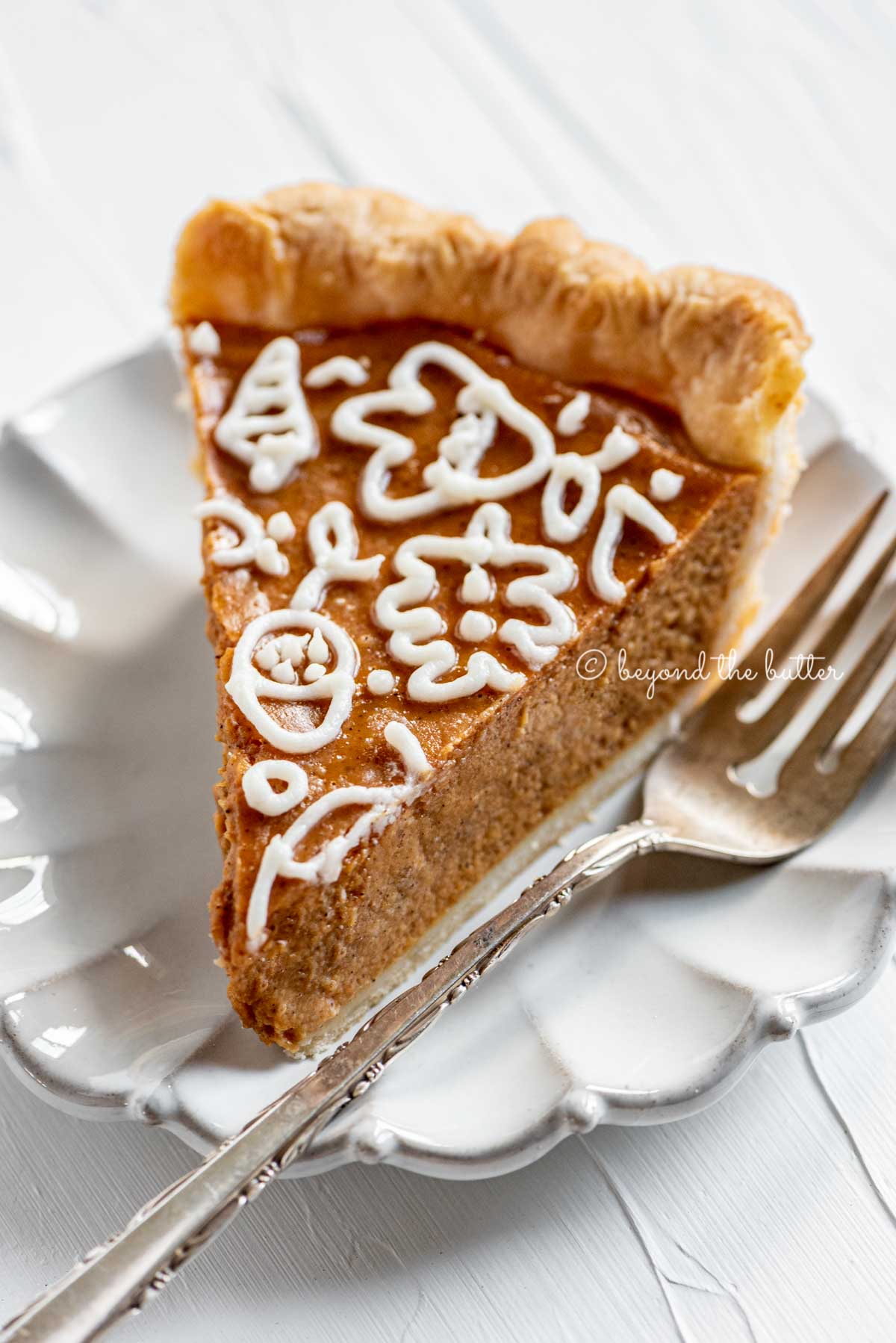 Slice of pumpkin pie on a dessert plate | All Images © Luyiz™