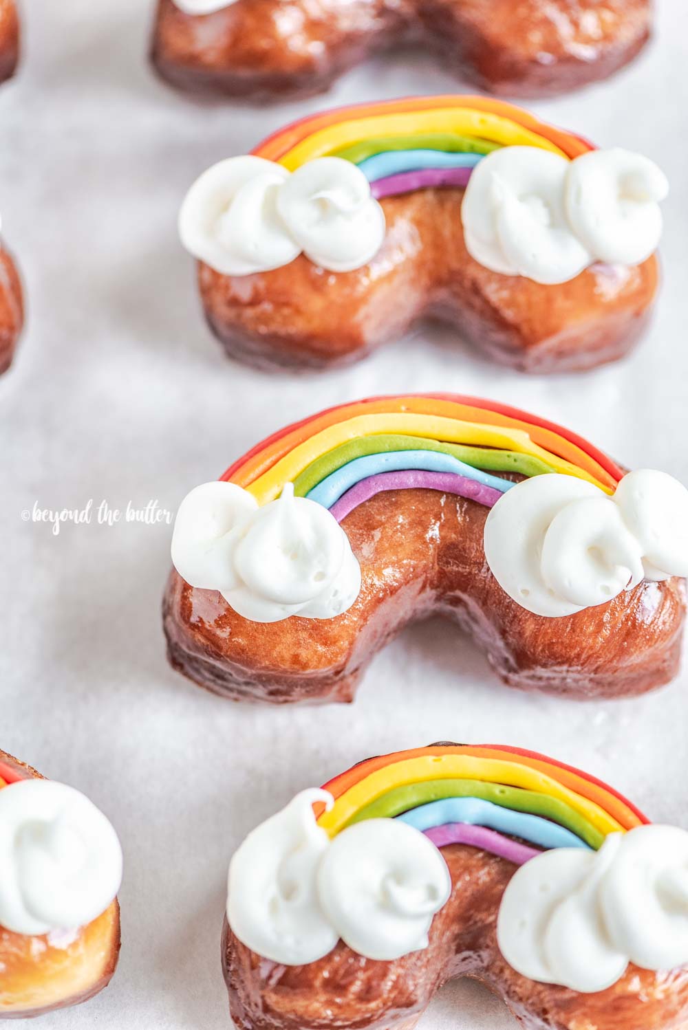 Overhead image of homemade Rainbow Donuts | All Images © Luyiz, LLC