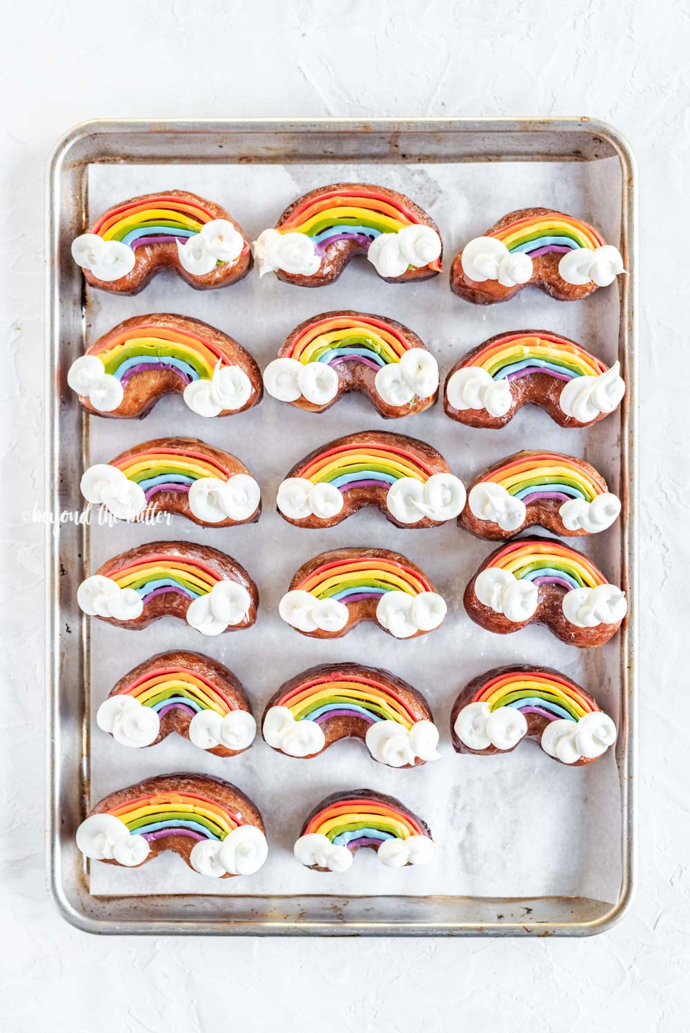 Overhead image of Rainbow Donuts on a baking sheet | All Images © Luyiz, LLC