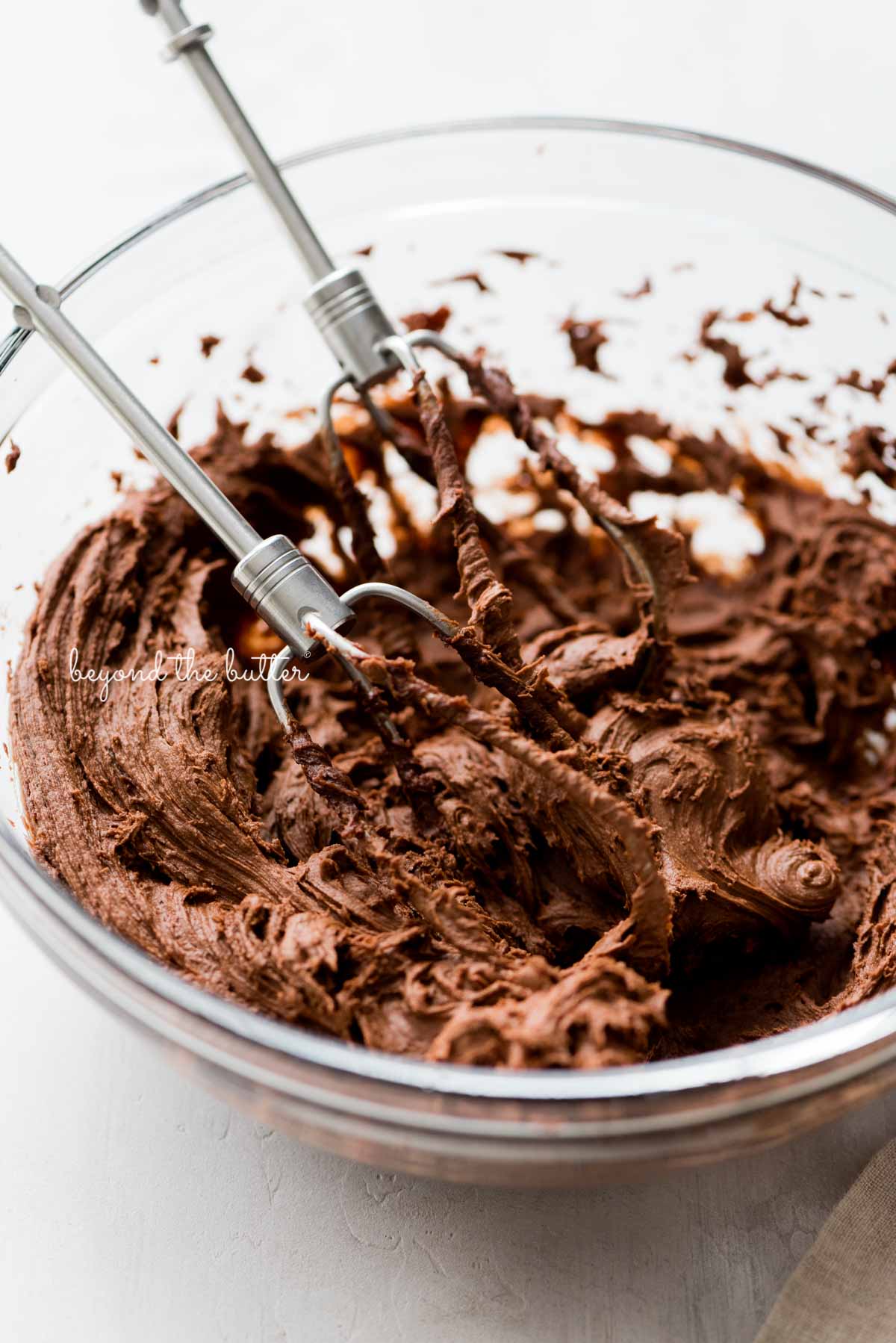 Milk chocolate frosting to sandwich the robin's egg macaron shells together | All Images © Luyiz®