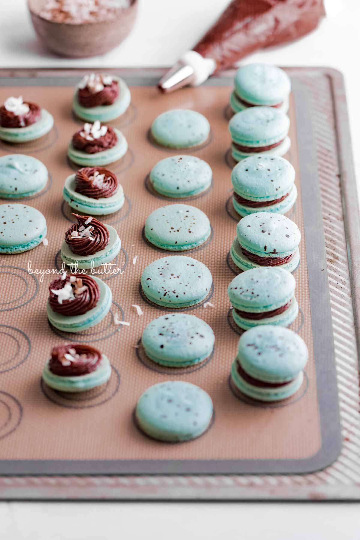 Assembling the robin's egg macarons on a silicone baking mat | All images © Luyiz®