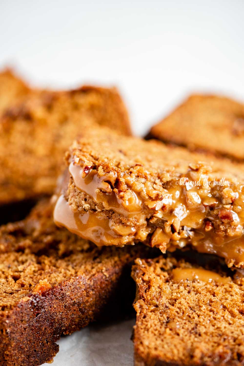 Closeup overhead image of slices of salted caramel banana nut bread on their side | All Images © Luyiz™