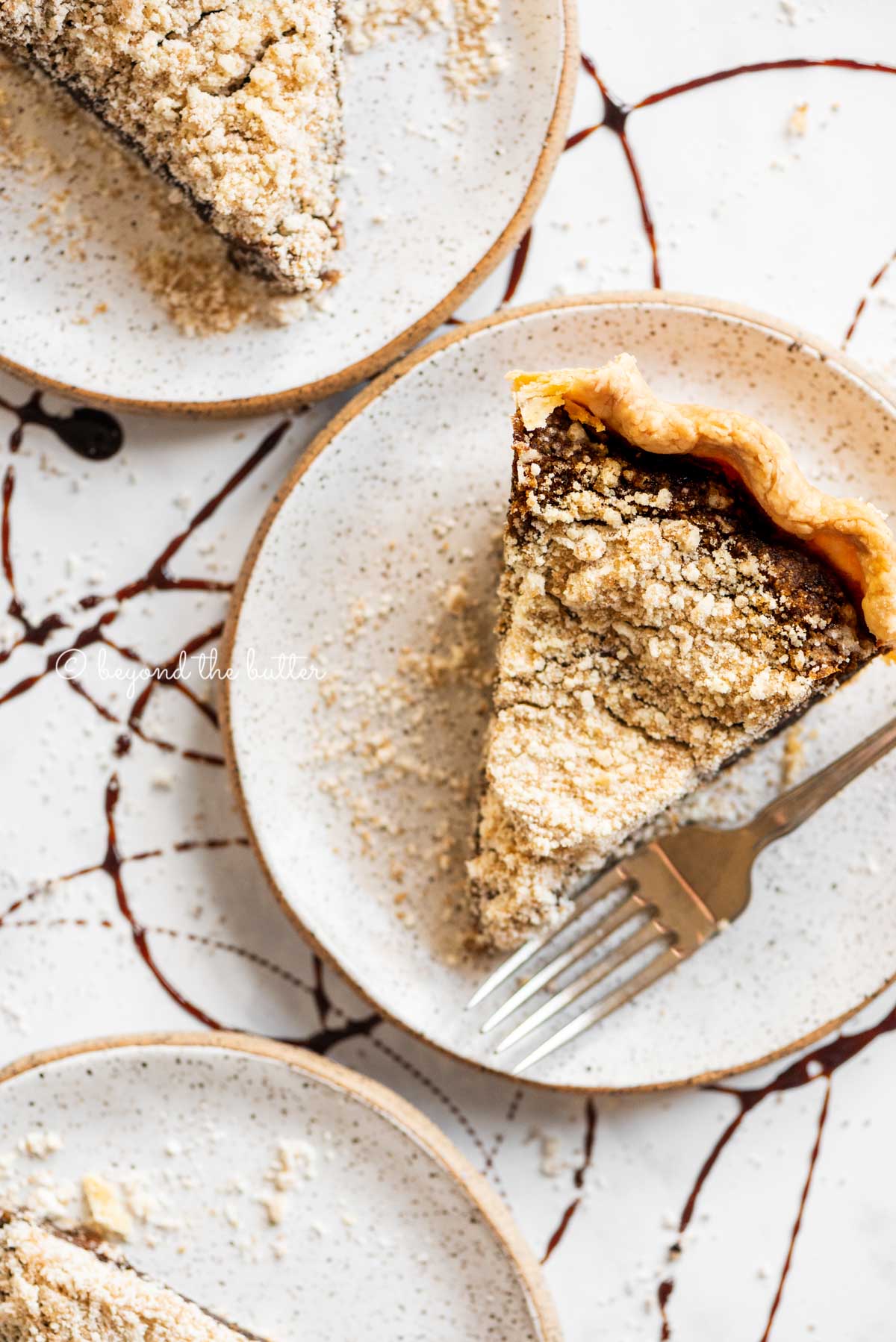 Slices of shoo fly pie on dessert plates | All Images © Luyiz™