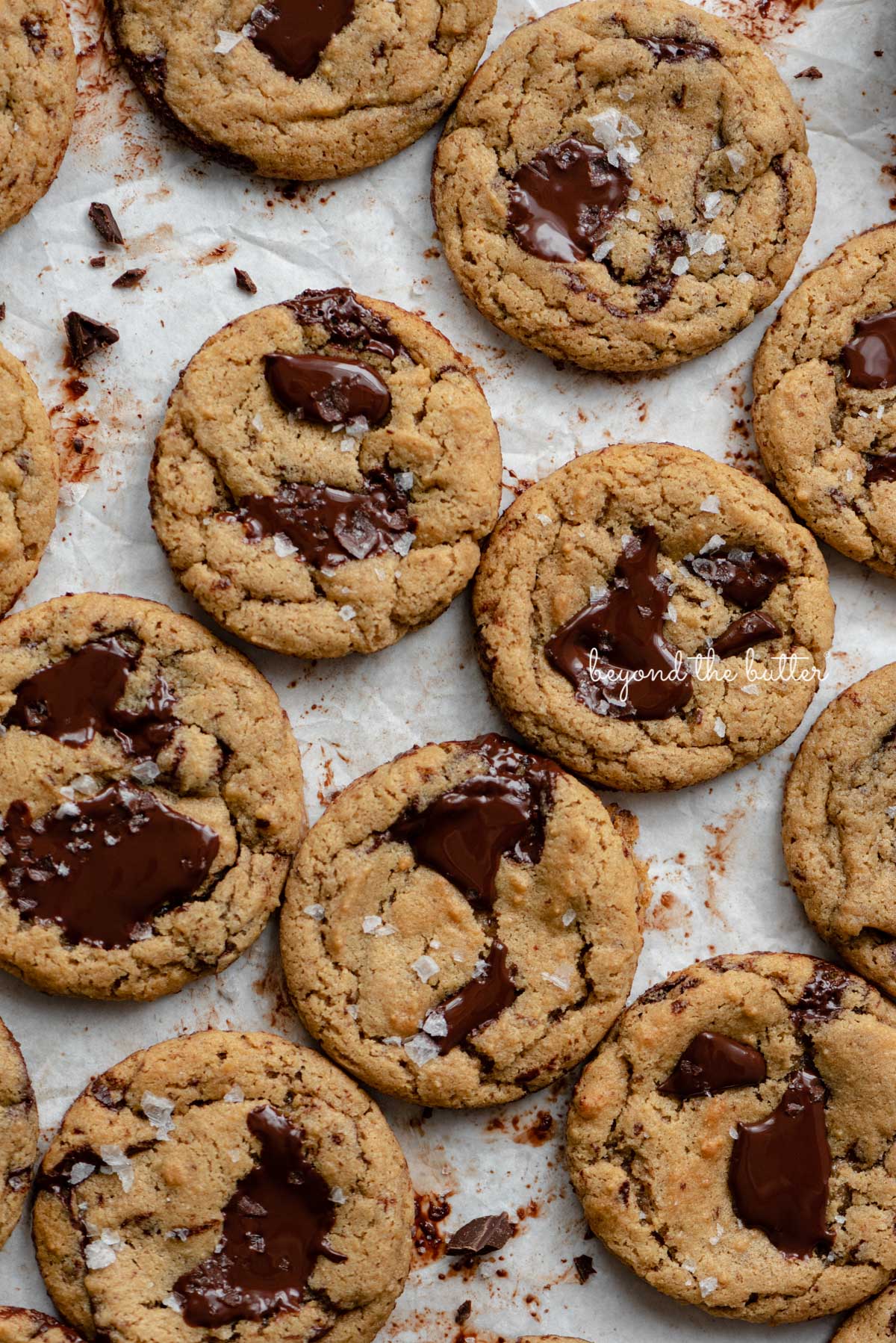 Small batch gluten-free peanut butter chocolate chunk cookies on a parchment paper lined baking sheet | © Luyiz®