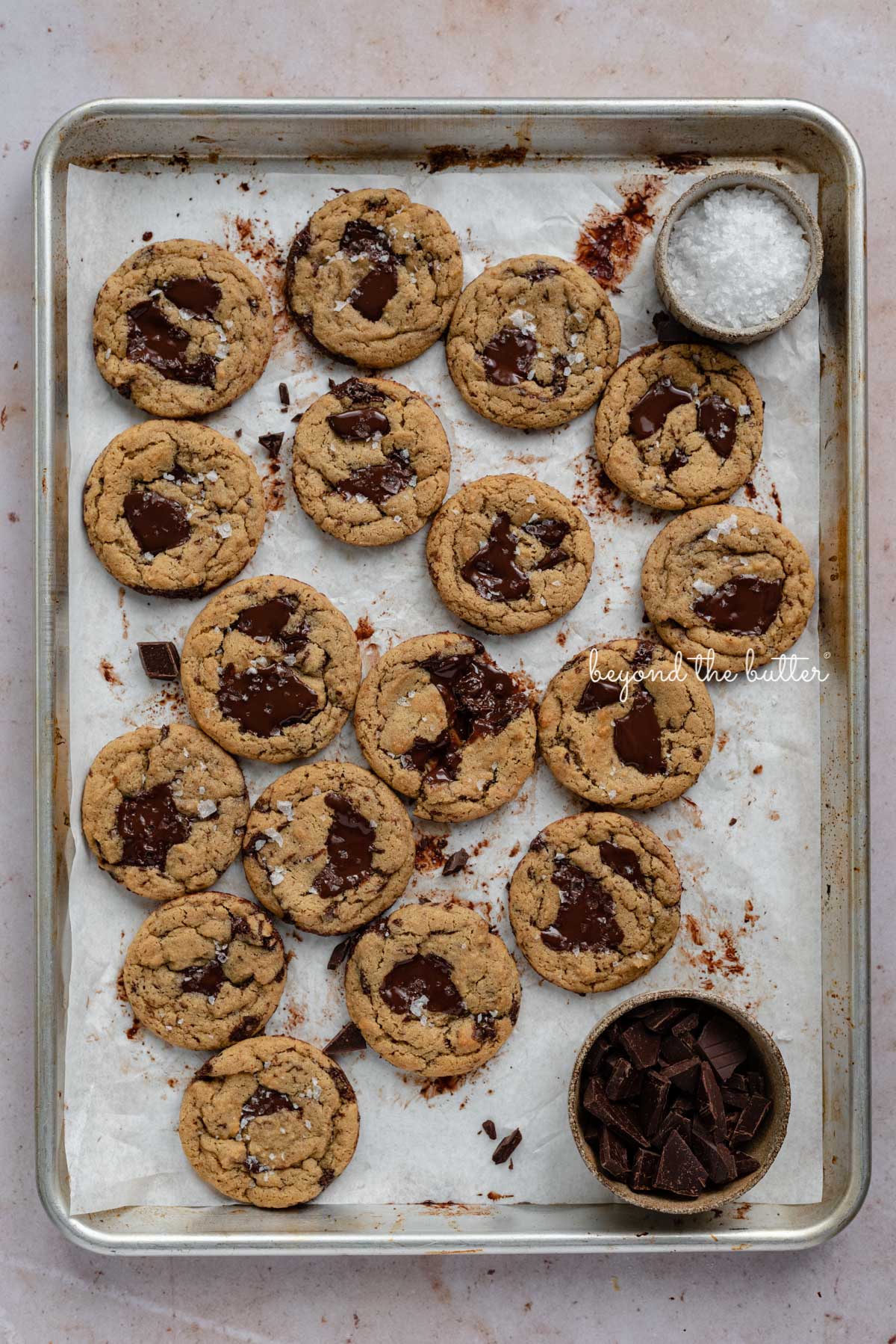 Small batch gluten-free peanut butter chocolate chunk cookies on a parchment paper lined baking sheet | © Luyiz®
