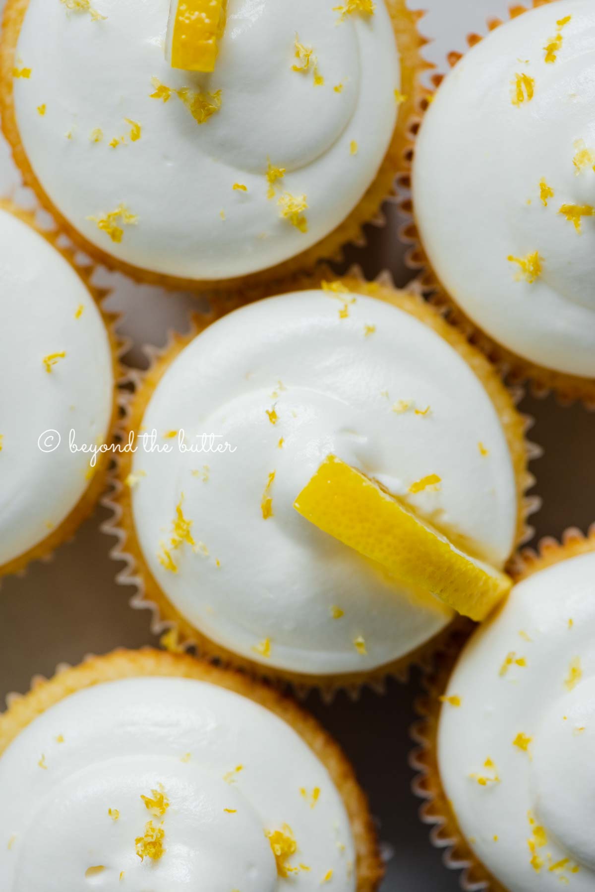 Close up of decorated small batch lemon cupcakes | All Images © Luyiz®