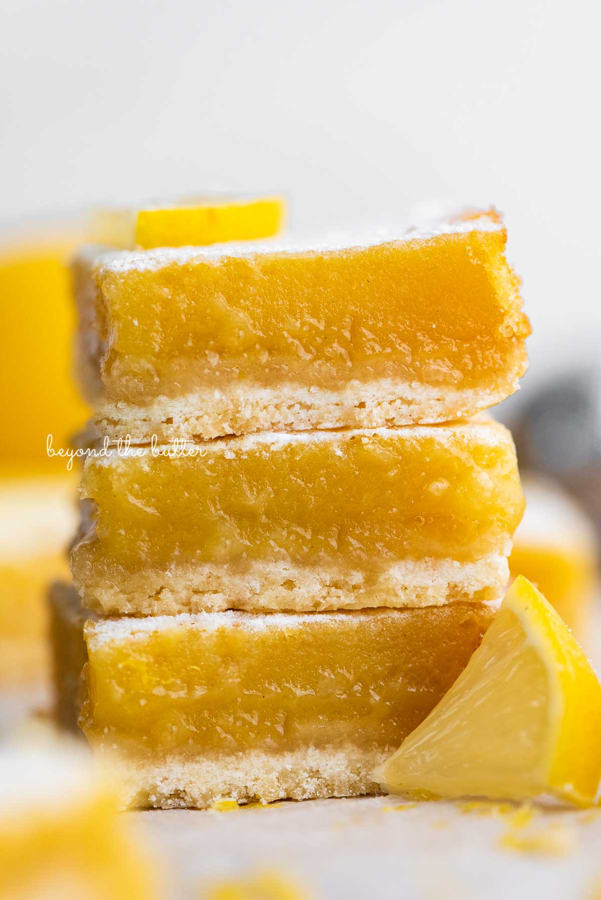 Stack of three lemon bars on white background | © Luyiz®