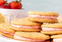 Lemon Sandwich Cookies with Strawberry Buttercream Filling