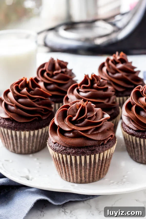 Decadent Chocolate Cream Cheese Frosting Recipe for Cakes & Cupcakes 6 A plate of cupcakes with cream cheese chocolate frosting