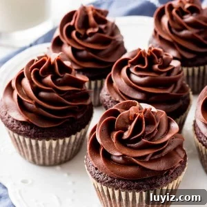 Chocolate cream cheese frosting is thick, creamy, silky smooth, and not too sweet Pipes beautifully on cupcakes & cakes