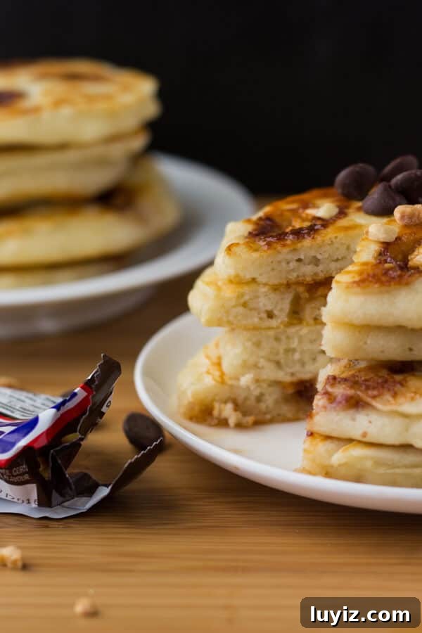 Snickers-Inspired Pancakes with Caramel, Peanut & Chocolate Swirl 2 Super fluffy, diner-style pancakes filled with Snickers bars. Because clearly - you can't go wrong with pancakes and your favorite candy bar.