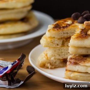 Snickers-Inspired Pancakes with Caramel, Peanut & Chocolate Swirl 4 Super fluffy, diner-style pancakes filled with Snickers bars. Because clearly - you can't go wrong with pancakes and your favorite candy bar.