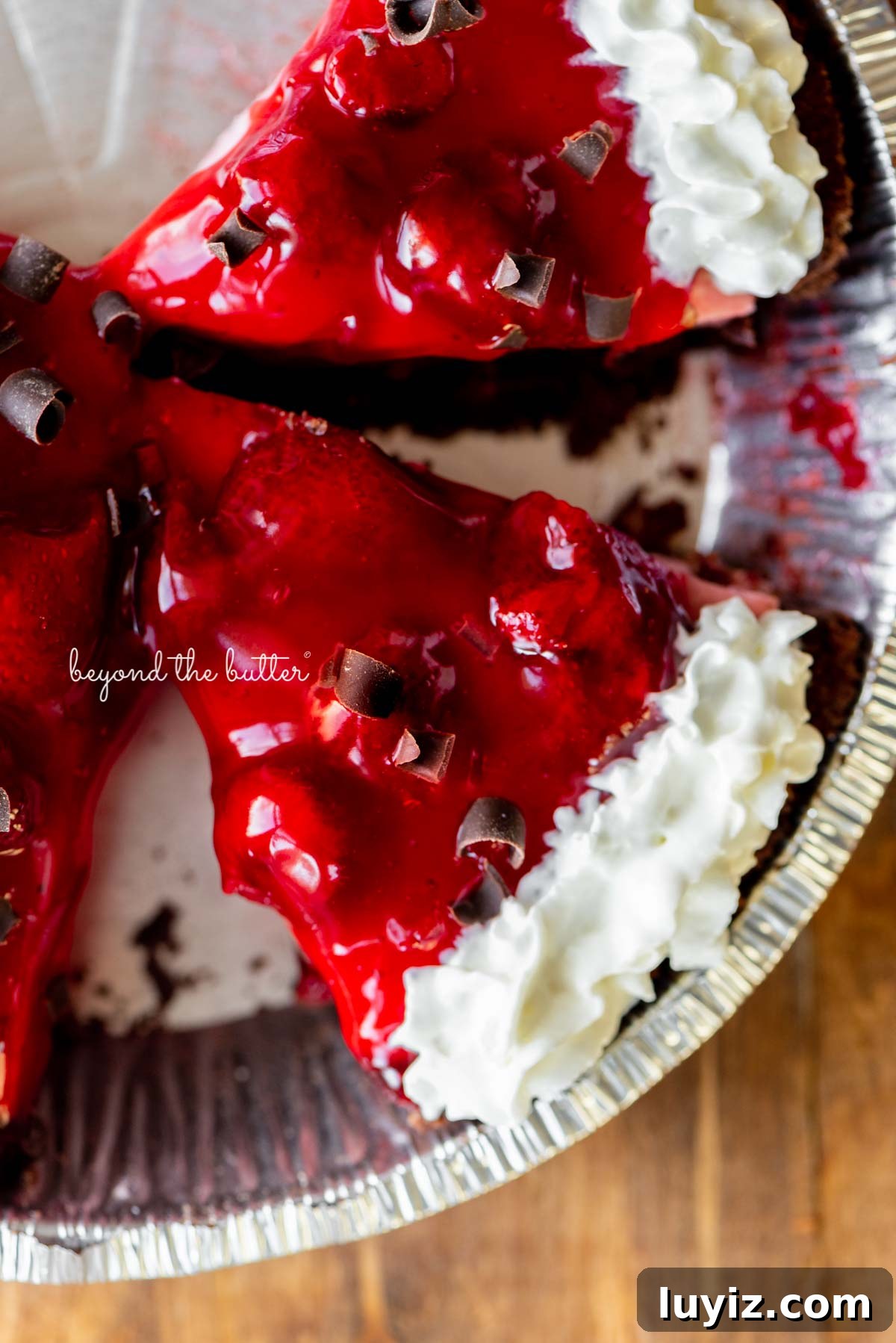 No-Bake Chocolate Strawberry Pie Recipe for Summer Parties 4 Sliced no bake strawberry chocolate cream pie on wood table | All images © Beyond the Butter®