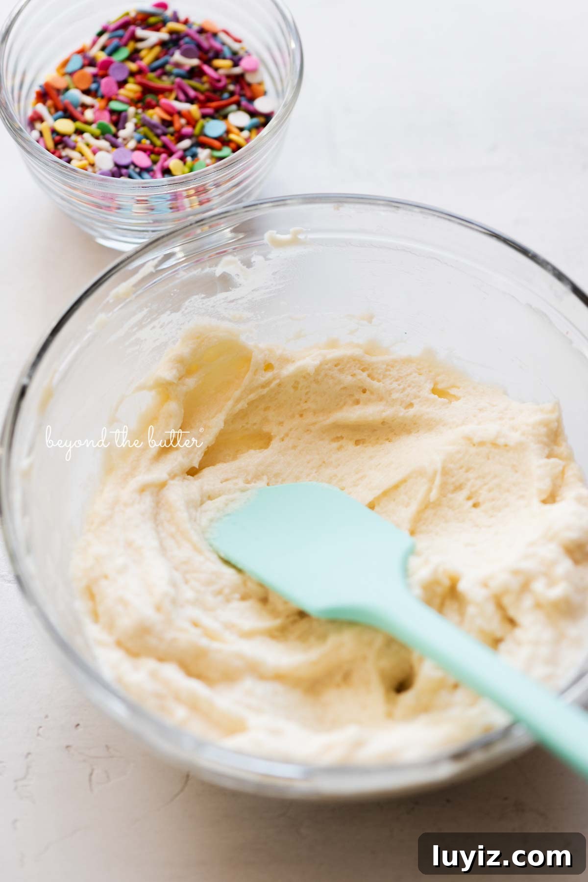 Single-Layer Funfetti Cake Recipe: Quick Party Dessert 8 Small batch vanilla fluor buttercream frosting ready for the rainbow jimmies from BeyondtheButter.com | All images © Beyond the Butter®