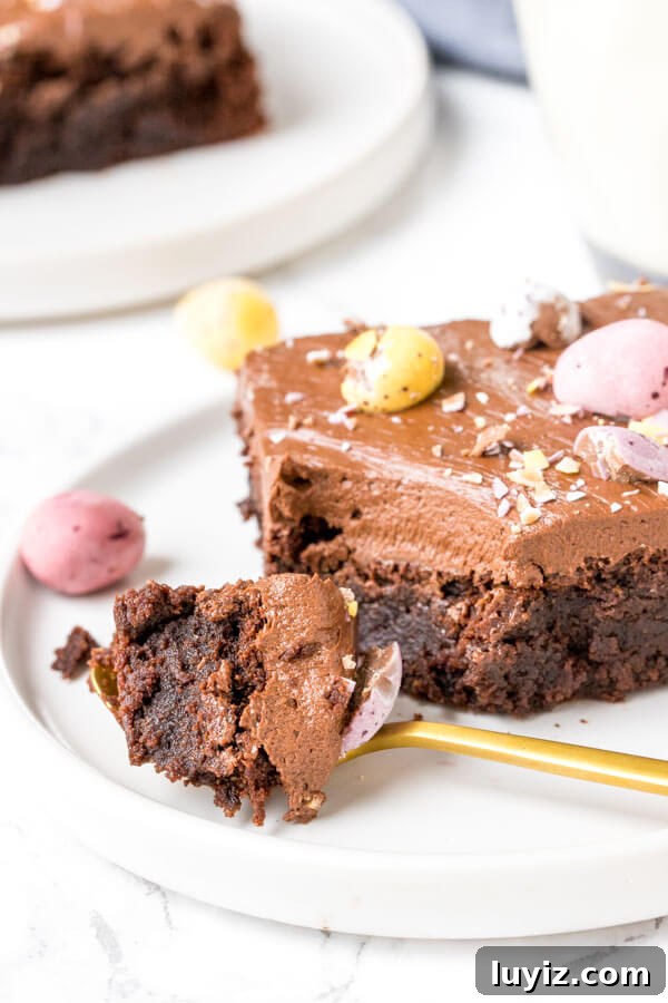 Mini Egg Brownies Recipe: Fudgy Chocolate Treat with Mini Eggs 4 Close up shot of a mini egg brownie with a bite taken out of it.