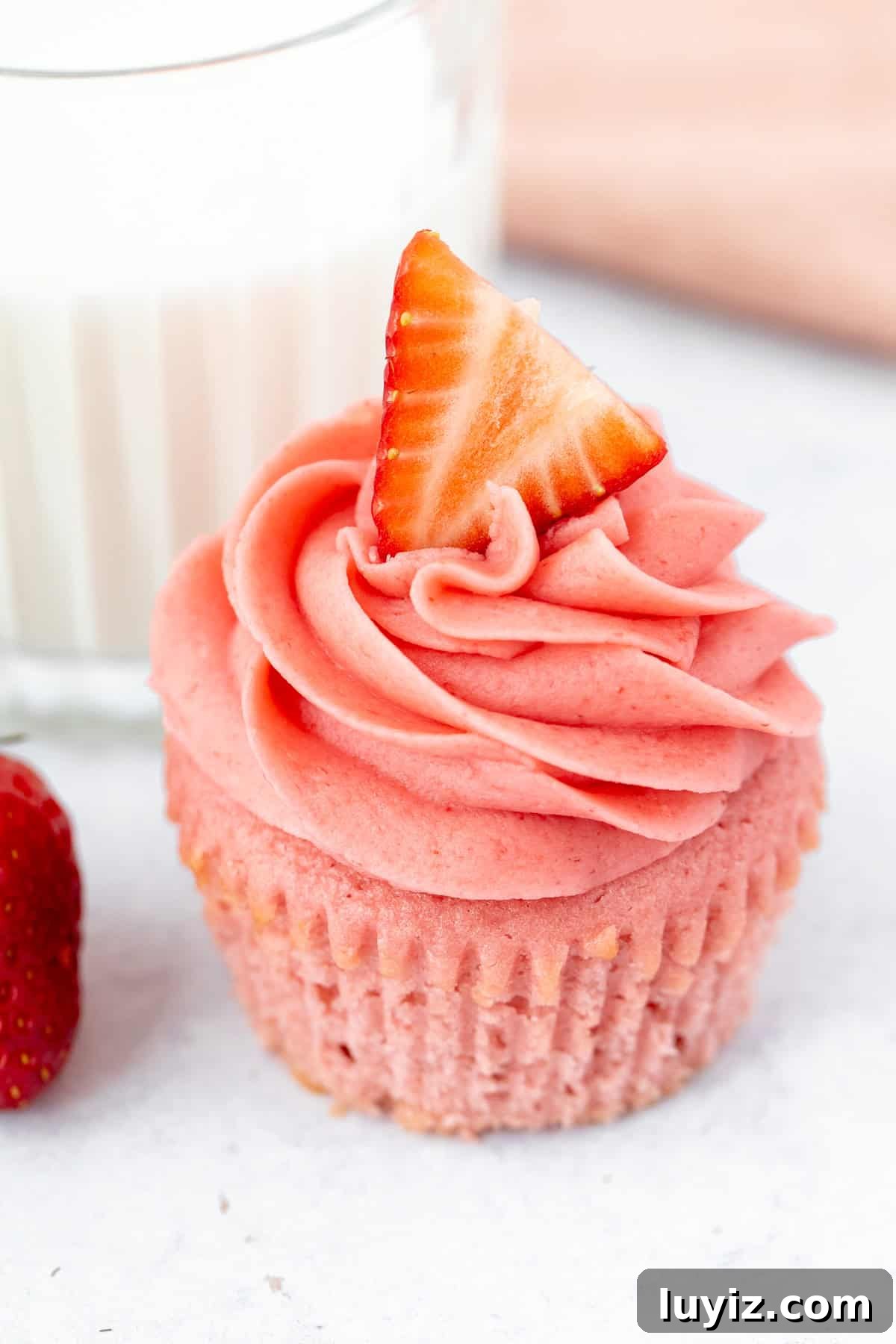 Moist Strawberry Cupcakes with Fresh Strawberry Frosting 4 pink strawberry cupcake topped with strawberry frosting