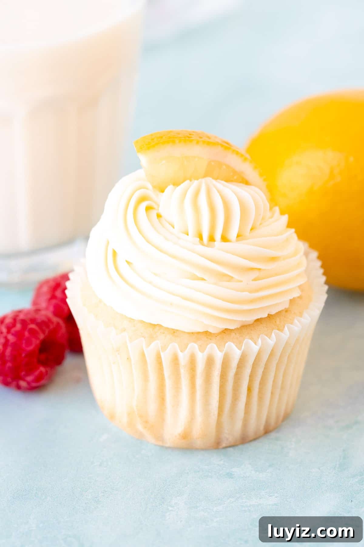 Zesty Lemon Cupcakes with Luscious Lemon Buttercream Frosting 2 Lemon cupcake with lemon frosting with glass of milk