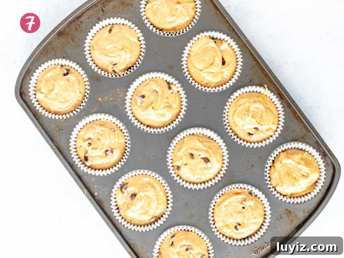 Irresistible Peanut Butter Muffins with a Crispy Top 5 Muffin tin of unbaked peanut butter muffins