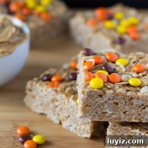 Crunchy Peanut Butter Granola Bars Recipe for Homemade Snacks 5 Make these super easy & super delicious Peanut Butter Granola Bars. Topped with Reese's Pieces - kids & adults will love these treats.