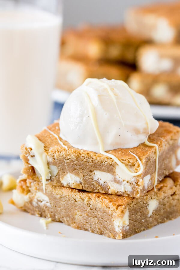 White Chocolate Macadamia Blondie Recipe — Chewy & Decadent 2 Chewy, fudgy & completely irresistible - these white chocolate macadamia blondies are the perfect blondie recipe.
